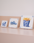 All three tile sizes on their suitable acrylic tile stands, displayed on a cabinet