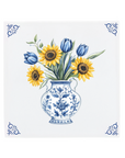 Decorative tile with a blue and white vase holding sunflowers and tulips on a delft blue tile