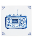 Ceramic Dutch Tile with decorative corner ornaments, featuring a vintage radio with Delft blue flower motifs.