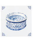 A hot tub on a Delft Blue ceramic tile with decorative corner ornaments