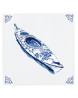 A kayak on a Delft Blue ceramic tile with decorative corner ornaments