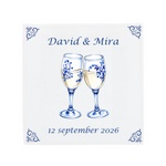 Two champagne glasses toasting on a Delft Blue ceramic tile with decorative corner ornaments