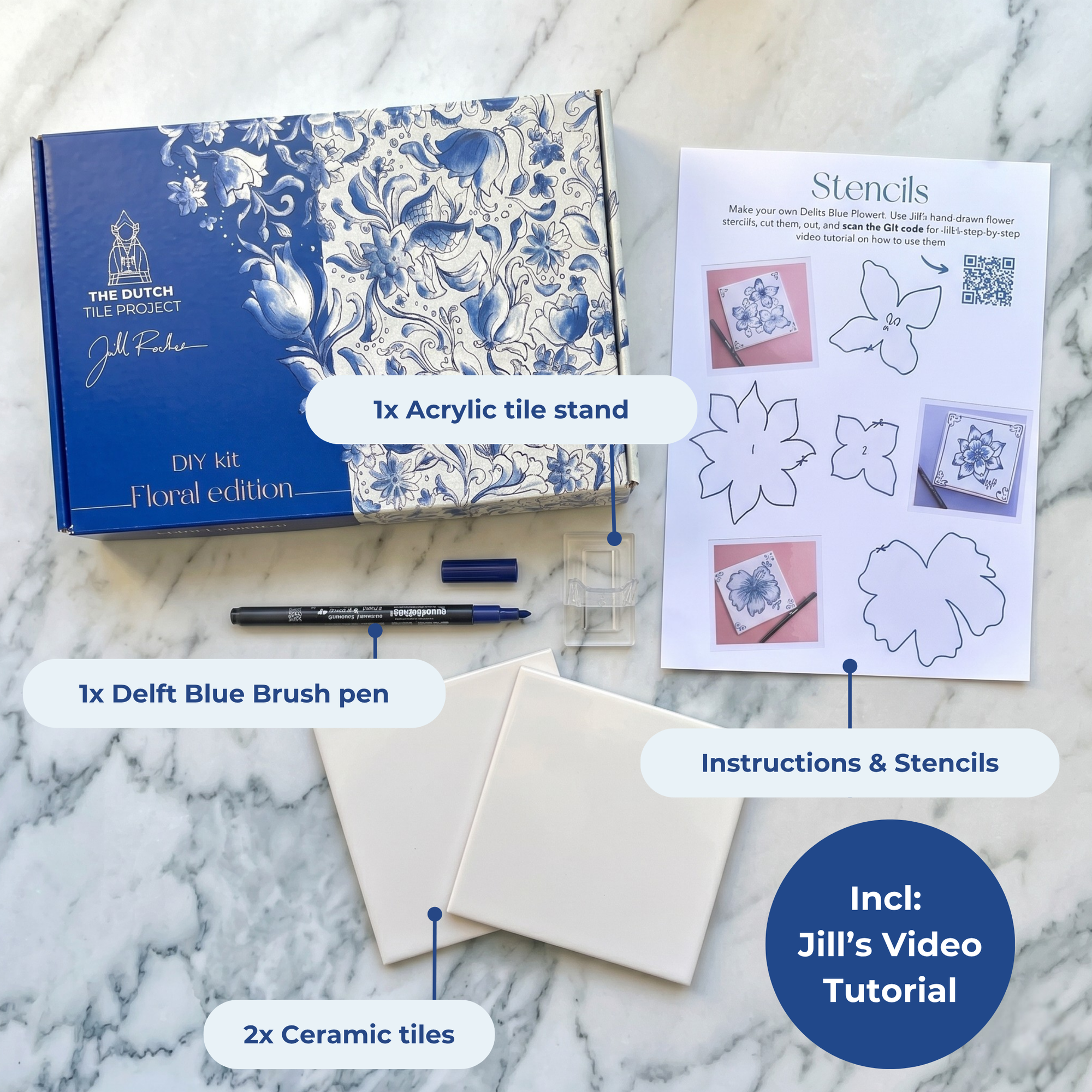 DIY kit contents displayed on a marble surface, including two ceramic tiles, a bent brush, an acrylic stand and instruction cards. [market:!nl]