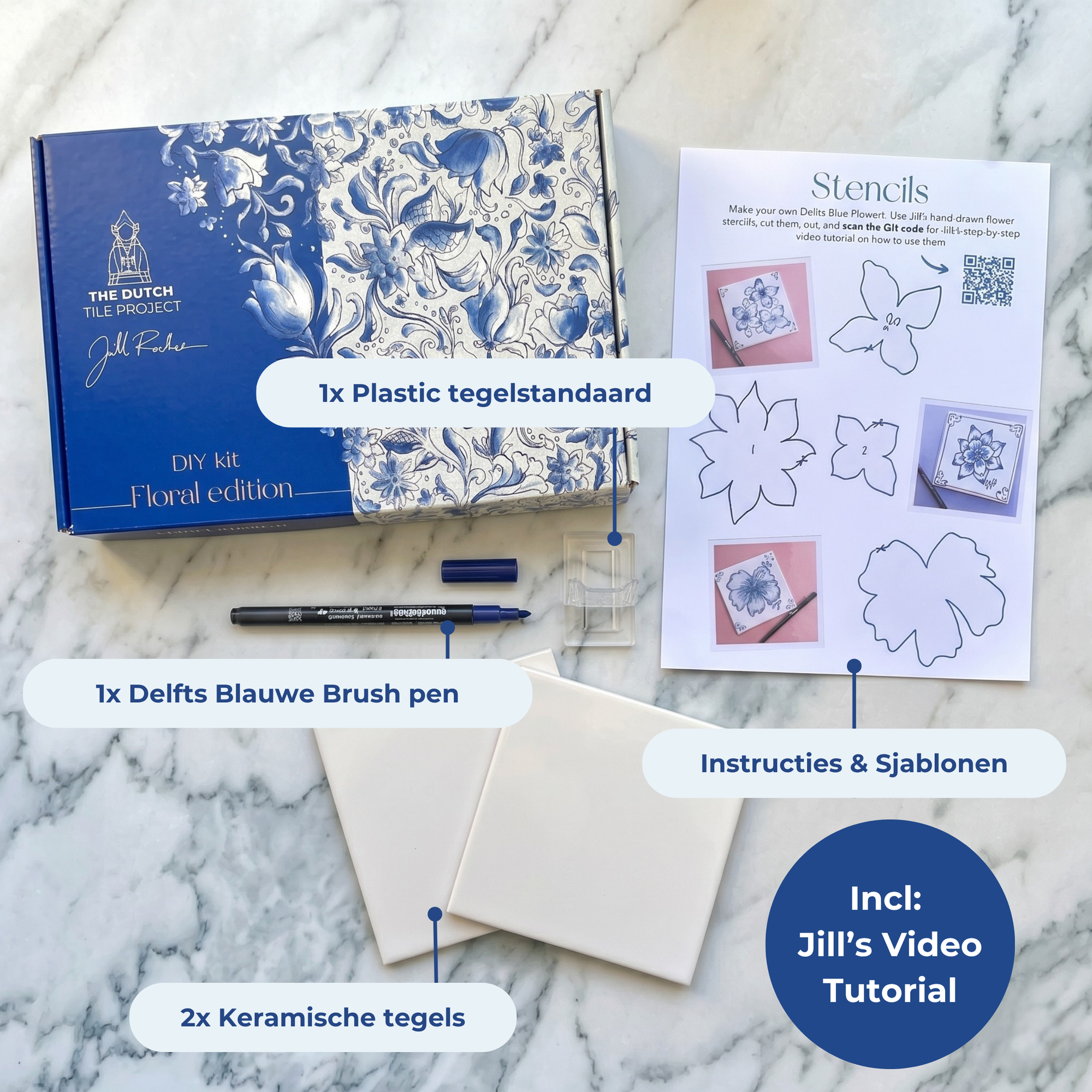 DIY kit contents displayed on a marble surface, including two ceramic tiles, a bent brush, an acrylic stand and instruction cards. [market:nl]