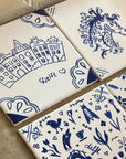 Four DIY kit tiles created by customers before baking the tiles