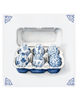 Ceramic Dutch Tile with decorative corner ornaments, featuring a six-egg carton in a Delft blue pattern.