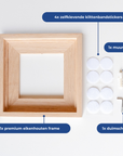 Eikenhouten frame en de meegeleverde materialen uitgestald op een tafel. [market:nl]