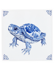 Decorative tile with a blue and white turtle design on a white background