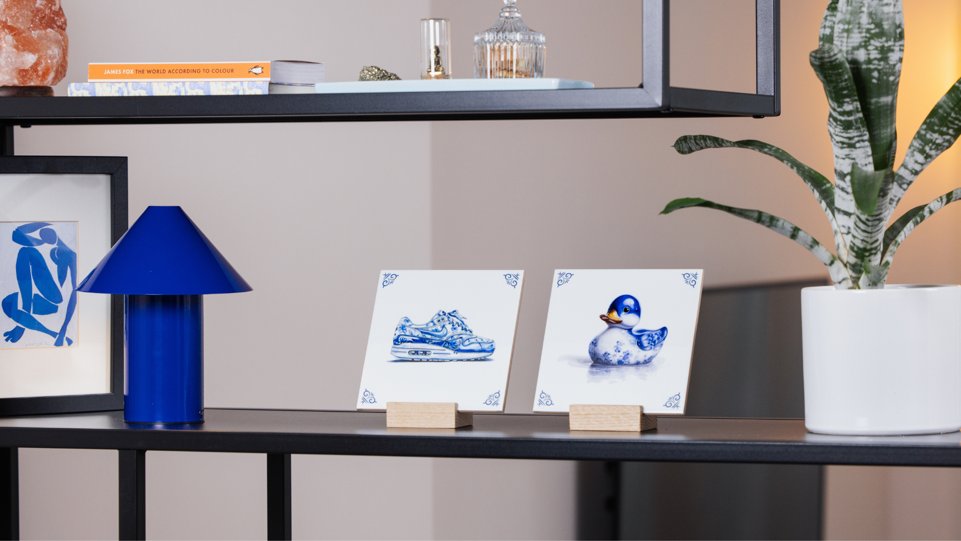 Airmax and ducky tile on a shelf