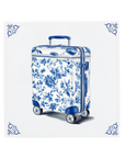 Ceramic Dutch Tile with decorative corner ornaments, featuring a wheeled suitcase with a Delft blue pattern.