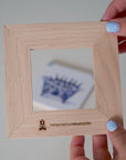 Wooden tile frame and holder for Delft Blue tiles, made from sustainable FSC®-certified Dutch oak wood and crafted in social workshops in the Netherlands.