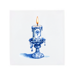 A lit candle on a Delft Blue ceramic tile without corner ornaments