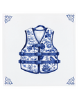 A life jacket on a Delft Blue ceramic tile with decorative corner ornaments