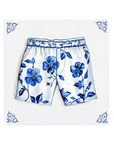 A pair of boxer shorts on a Delft Blue ceramic tile with decorative corner ornaments